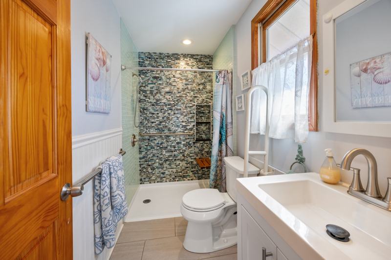 Bathroom with mosaic tile walk-in shower
